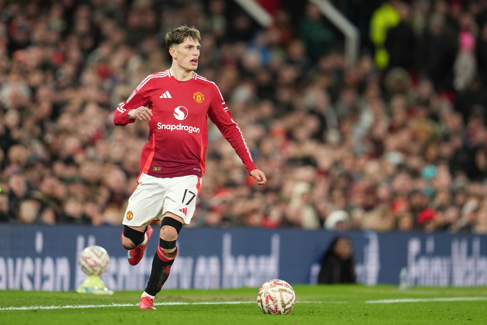 Manchester United's Alejandro Garnacho in action during the English FA Cup soccer match between Manchester United and Fulham at the Old Trafford stadium in Manchester, England, Sunday, March 2, 2025. (AP Photo/Jon Super)