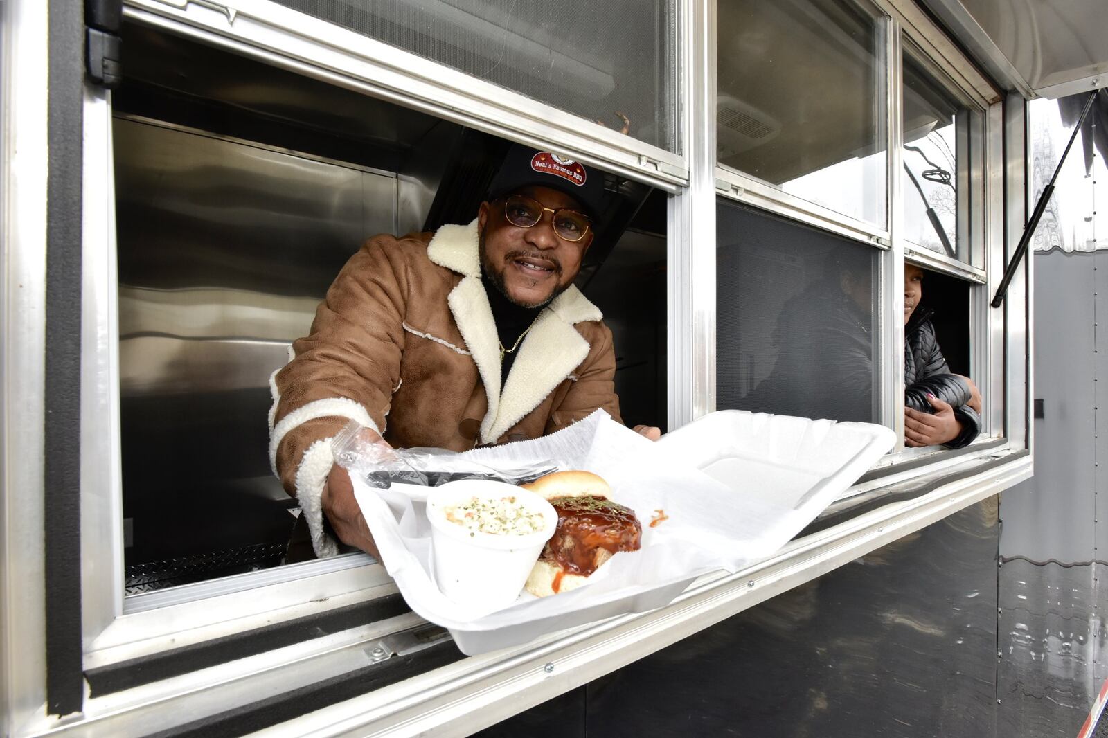 Mike Neal, owner of Neal’s Famous BBQ, has a new location, Neal’s Grab ‘N’ Go, now open at 997 Eaton Ave. in Hamilton. The modest storefront is strategically located next to Flub’s Ice Cream, providing a dinner-and-dessert dining option to hungry Hamiltonians. On Friday, three days before that locations ribbon-cutting ceremony, he received delivery of his third restaurant, Neal s on Wheels, which was built by a custom food truck manufacturer in Fitzgerald, Ga. Neal stands inside the new Neal s On Wheels trailer that he plans to have wrapped with his logo and photos of his food items. NICK GRAHAM/STAFF