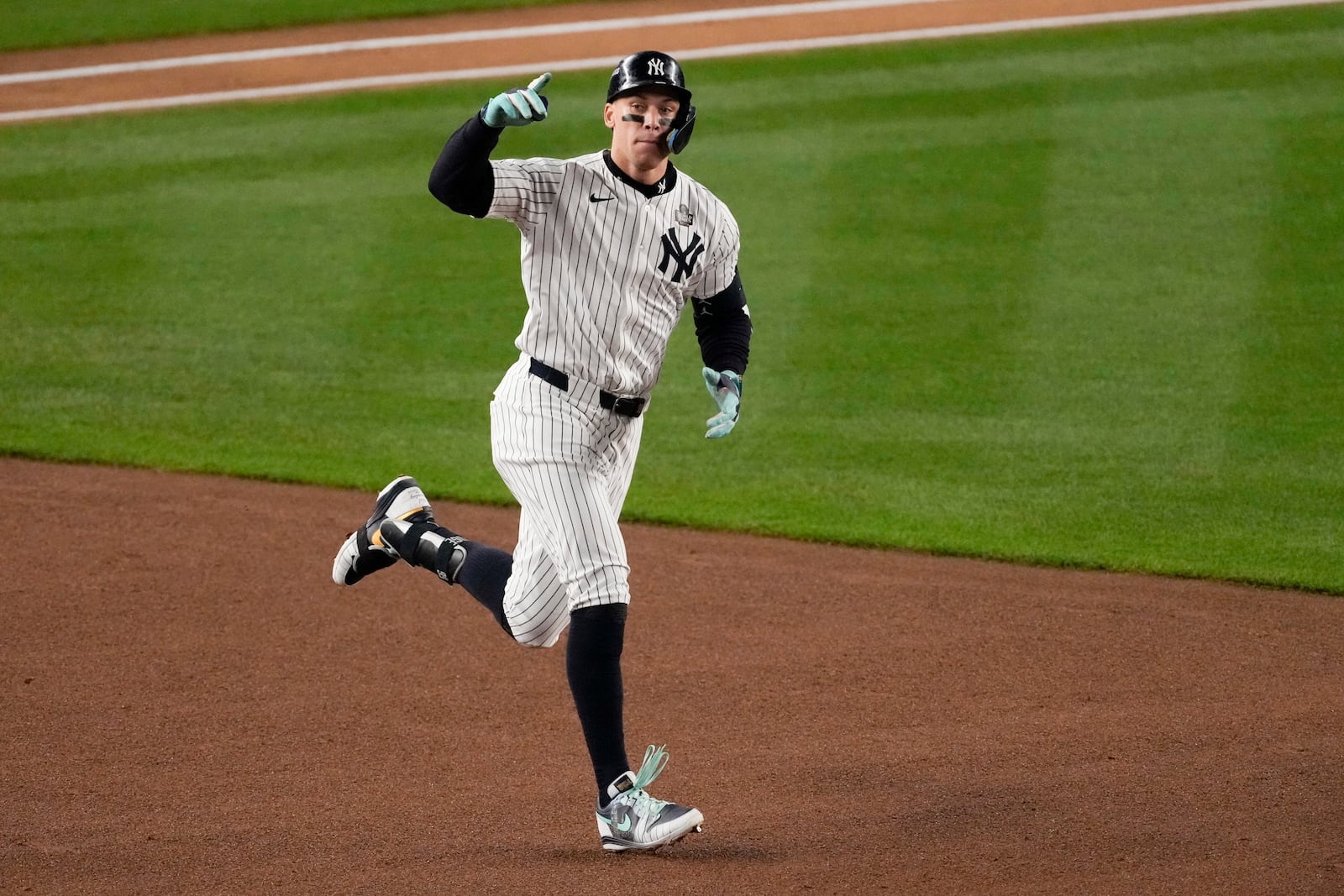 New York Yankees' Aaron Judge rounds the bases after a two-run home run against the Los Angeles Dodgers during the first inning in Game 5 of the baseball World Series, Wednesday, Oct. 30, 2024, in New York. (AP Photo/Frank Franklin II)