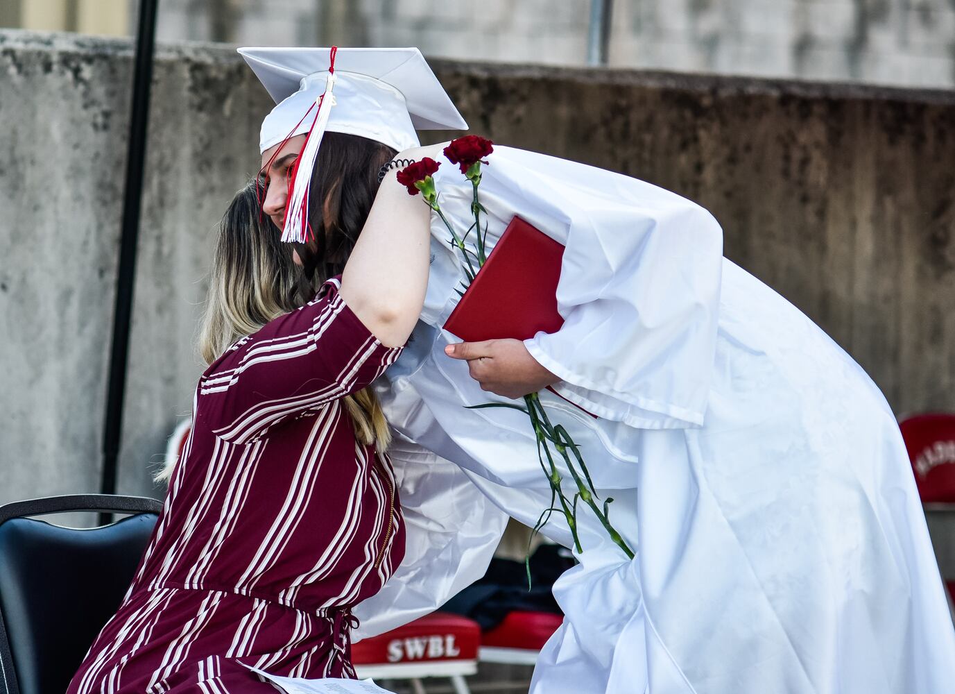 Madison High School drive-thru graduation ceremony at Land of Illusion