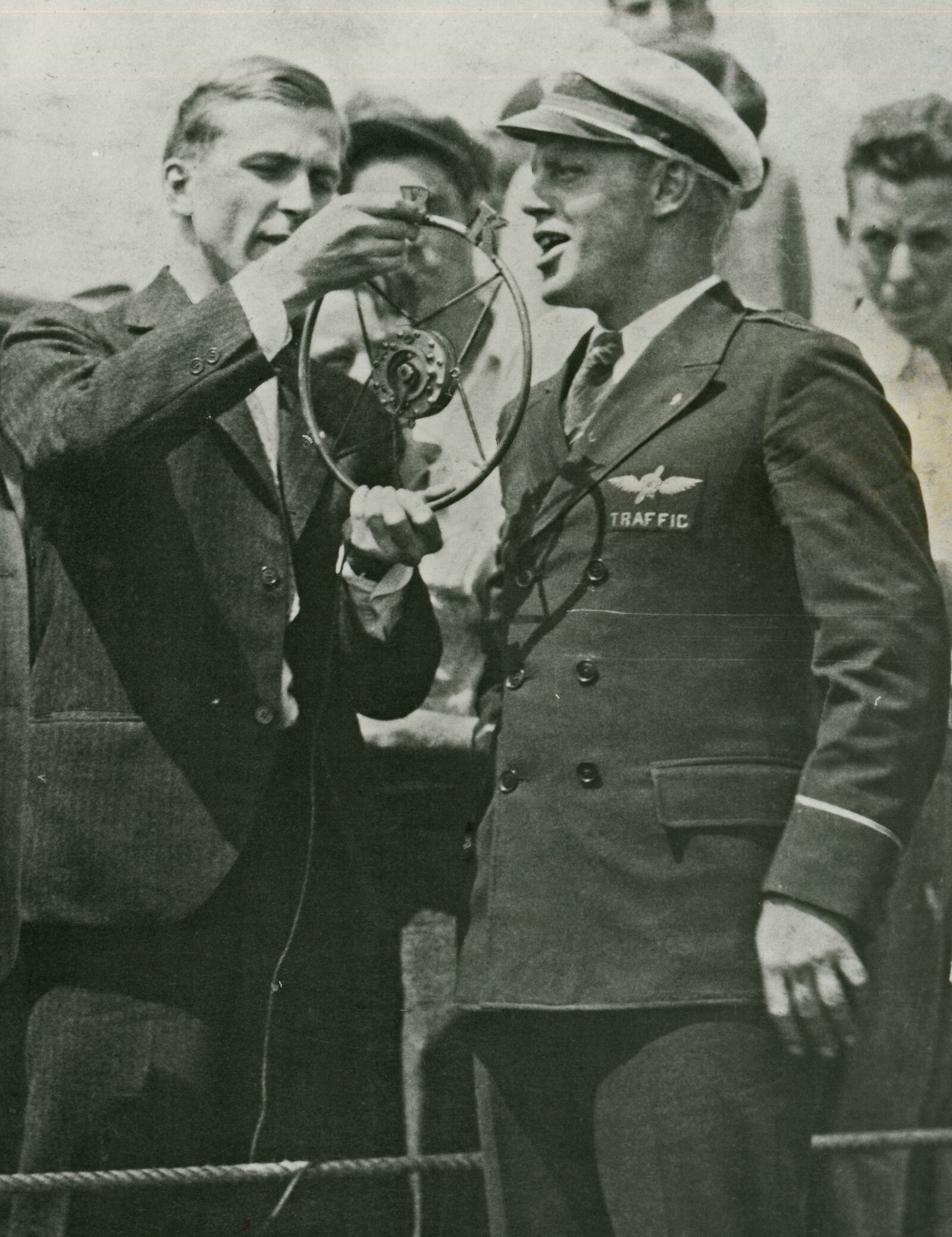 John C. Slade (left) of WRK, interviewing a pilot at the Hamilton Ford Airport. Photograph courtesy of the George C. Cummins collection at Lane Public Library.