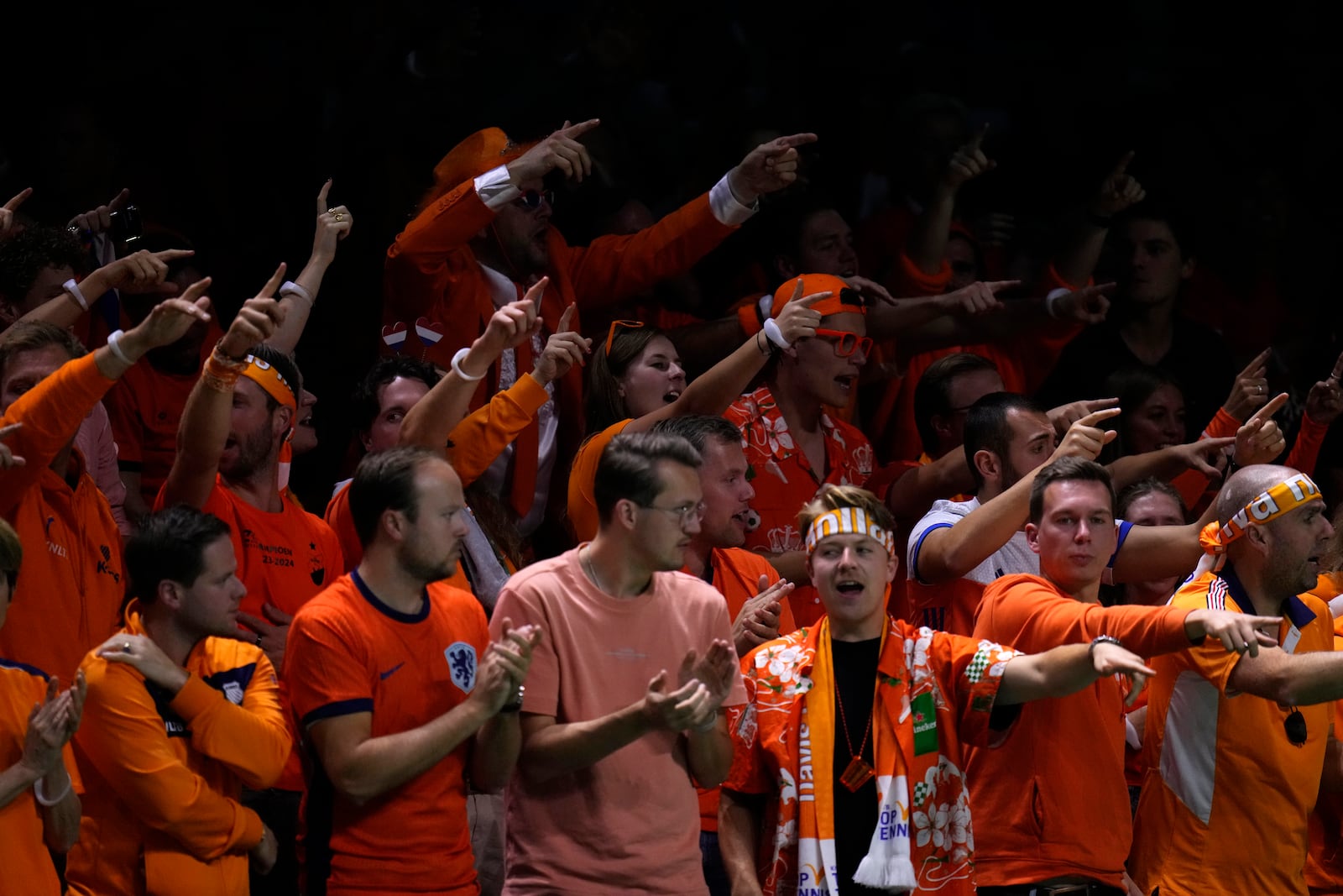 Dutch tennis fans gesture while Netherlands' Tallon Griekspoor plays Italy's Jannik Sinner during the Davis Cup final tennis match between Netherlands and Italy at the Martin Carpena Sports Hall in Malaga, southern Spain, Sunday, Nov. 24, 2024. (AP Photo/Manu Fernandez)