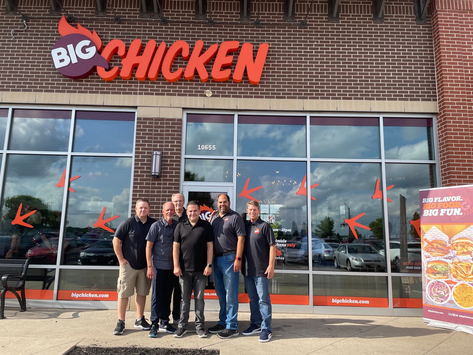 Franchisee Steve Christensen, Franchisee Mike Craddick, Franchisee Reid Richards, CEO Josh Halpern, SVP of Franchise Sam Stanovich and Franchisee Lynn Christensen (left to right) stand outside the new Big Chicken restaurant in Miami Twp. during a VIP event.