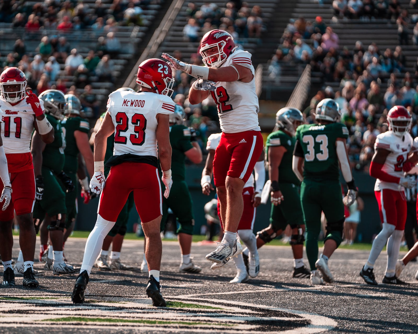 Miami's Corban Hondru (12) and Oscar McWood (23) celebrate during their game against Eastern Michigan on Saturday. Miami Athletics photo