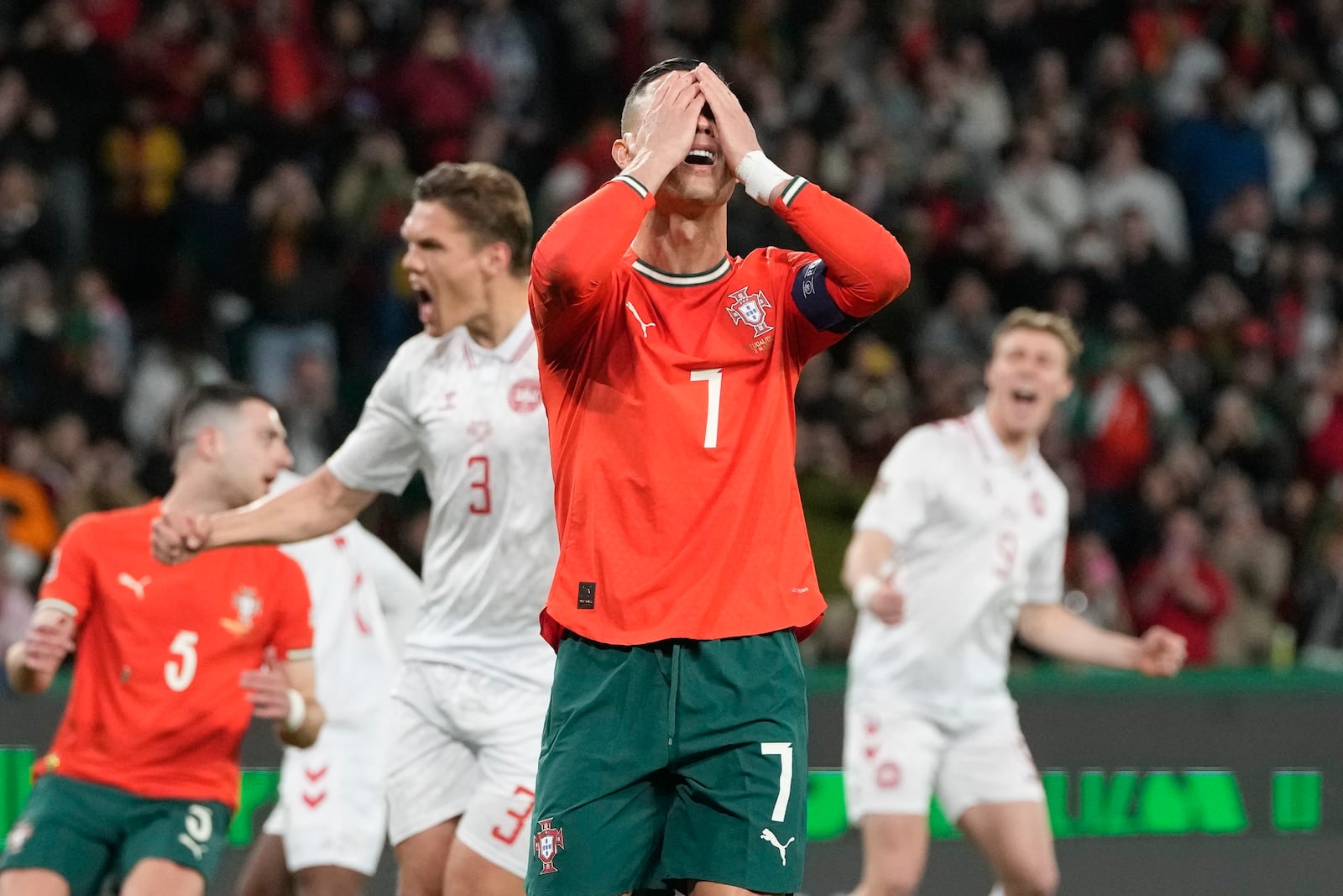 Portugal's Cristiano Ronaldo reacts after he fails to score with a penalty during the UEFA Nations League soccer match between Portugal and Denmark, at the Jose Alvalade Stadium in Lisbon, Sunday, March 23, 2025. (AP Photo/Armando Franca)