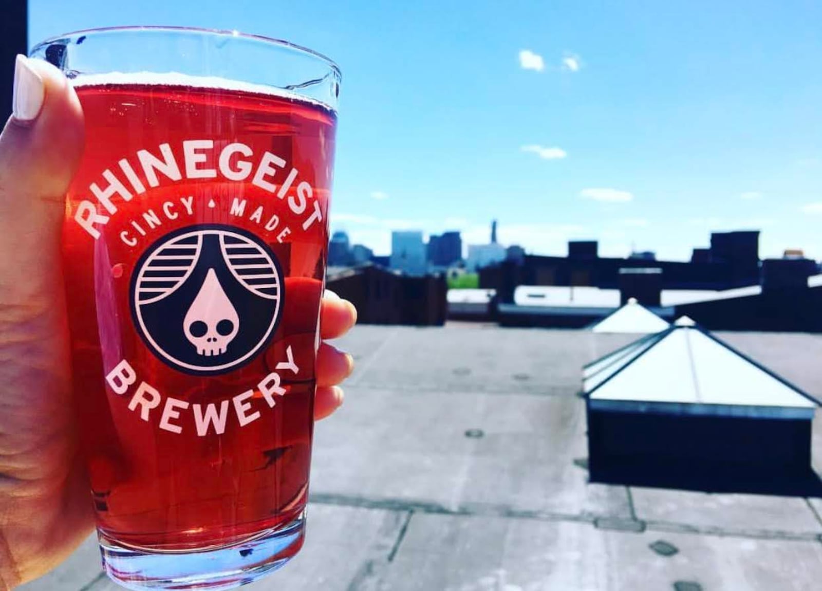 Cincinnati is bursting with breweries. Taste some local beers, like Rhinegeist and Taft's Ale House. Rhinegeist's rooftop patio offers a view of Over the Rhine. KARA DRISCOLL/STAFF