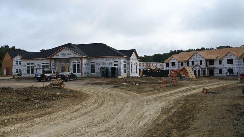 The Remington Lake development in Hamilton is a few months away from seeing some people move in. When they are open, it will have 22 buildings for 272 apartments behind Meijer on the city's west side. Pictured are some of the buildings under construction on Monday, July 29, 2024. MICHAEL D. PITMAN/STAFF