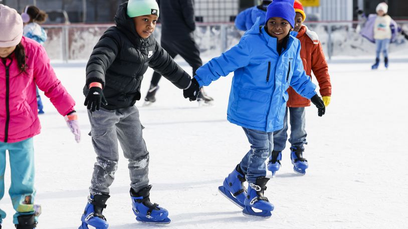 Creekview Elementary students Kashton Littles, left, and Dash Mitchell skate during an incentive field trip to the Middletown Holiday Whopla ice skating rink Friday, Jan. 5, 2024 in downtown Middletown. The holiday event, in its fourth year, kicks off on Nov. 11. NICK GRAHAM/STAFF