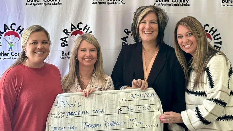 The Hamilton Junior Women’s League (HJWL) raised $25,000 for PARACHUTE: Butler County Court Appointed Special Advocate (CASA). The league held the Eat. Drink. Give – Masquerade Ball in February. Pictured with the check donation, from left are Jana Davis, HJWL president; Christy Schroeder, HJWL Eat. Drink. Give. event chair; Tonya Buchanan, executive director Parachute: Butler County CASA; and Jill Martin, HJWL Eat. Drink. Give. sponsorship chair. CONTRIBUTED