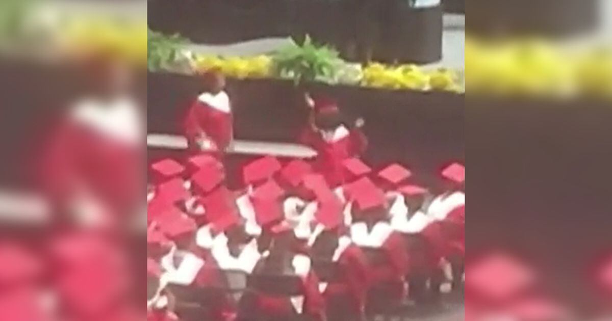 girl-escorted-from-ceremony-after-dancing-during-high-school-graduation