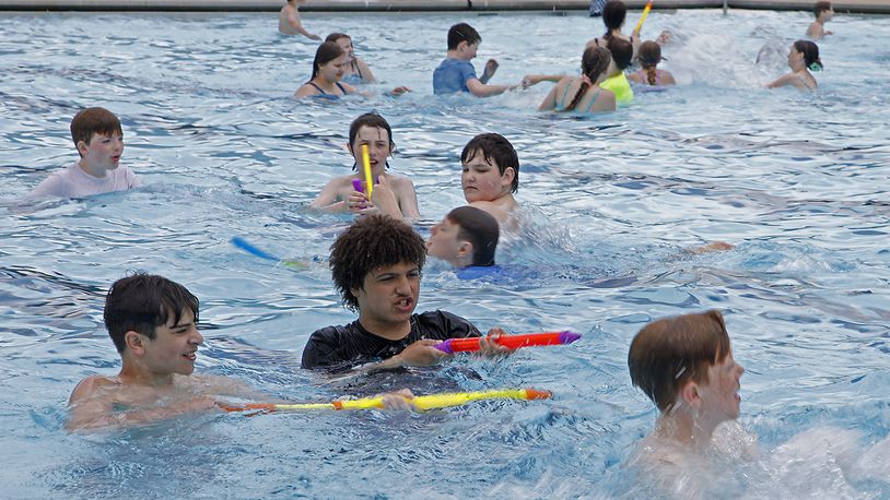 Tecumseh Middle School students got a chance to take an early dip in the New Carlisle Pool Wednesday, May 22, 2024. The pool officially opens to the public on Saturday for the Memorial Day weekend. BILL LACKEY/STAFF