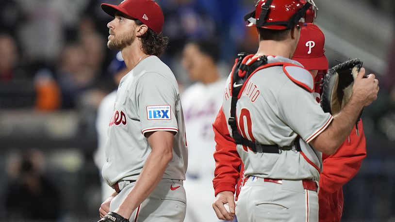 Philadelphia Phillies pitcher Aaron Nola (27) leaves the game during the sixth inning of Game 3 of the National League baseball playoff series against the New York Mets, Tuesday, Oct. 8, 2024, in New York. (AP Photo/Frank Franklin II)