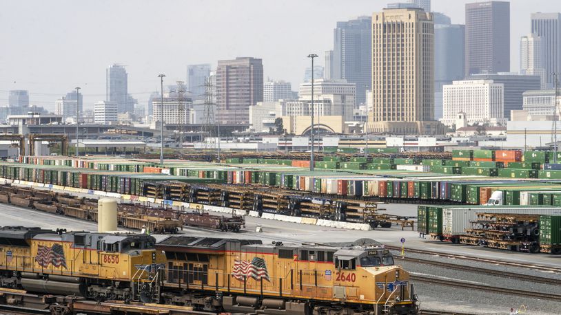 FILE - Los Angeles skyline is seen above the Union Pacific LATC Intermodal Terminal is seen on Tuesday, April 25, 2023 in Los Angeles. (AP Photo/Damian Dovarganes, File)