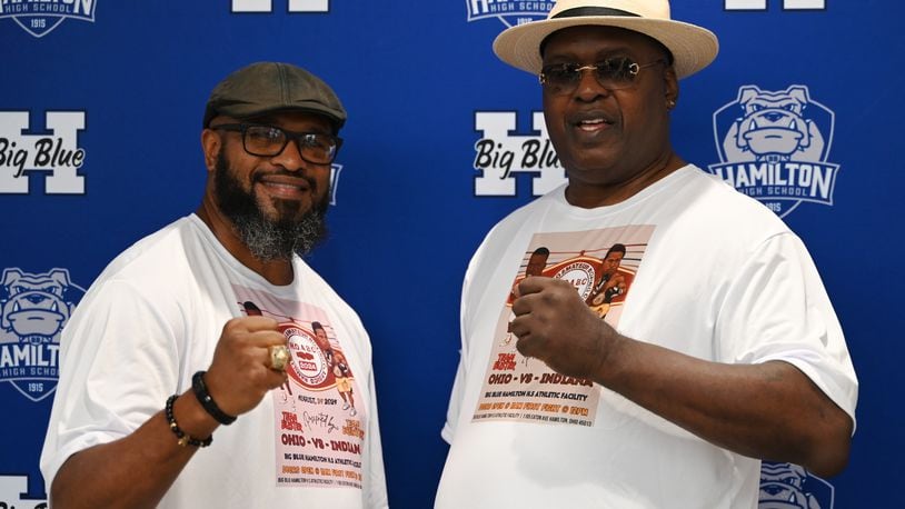 Former heavyweight boxing champions Lamon Brewster (left) and James "Buster" Douglas, pictured here at Hamilton High School on July 17, 2024, are leading a pair of teams of boxers for the Hamilton Ohio Amateur Boxing Classics happening at the high school on Saturday, Aug. 24. The pair will have a bowling fundraiser the day prior on Aug. 23 at Pohlman Lanes in Hamilton where people can bowl with the champs.  MICHAEL D. PITMAN/STAFF