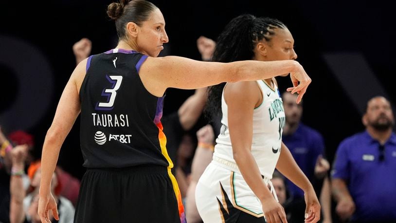 Phoenix Mercury guard Diana Taurasi (3) celebrates after her 3-point basket against the New York Liberty during the first half of a WNBA basketball game Monday, Aug. 26, 2024, in Phoenix. (AP Photo/Ross D. Franklin)