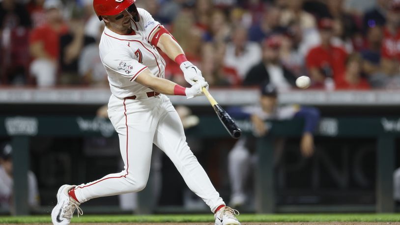 Cincinnati Reds' Spencer Steer hits a home run against the Atlanta Braves during the seventh inning of a baseball game, Tuesday, Sept. 17, 2024, in Cincinnati. (AP Photo/Jay LaPrete)