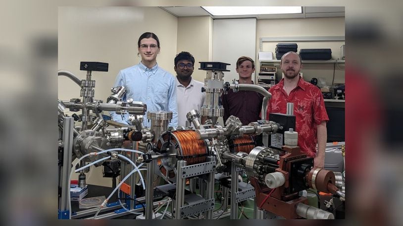 From left, Miami University students Carter Wade, Lakshan Don Manuwelge Don, Nate Price and Dr. Joseph Perry Corbett, tested the newly installed ultra-high vacuum scanning tunneling microscope at Miami University in Oxford. The microscope was donated by the Air Force Research Laboratory Materials and Manufacturing Directorate to the Corbett Research Group as part of a recently signed Educational Partnership Agreement with Miami. RANNET MANNING/CONTRIBUTED