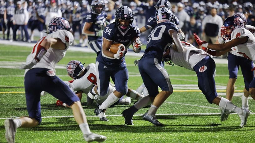 Edgewood's Tavionne Crosby runs for a touchdown in overtime of their playoff football game against Piqua Friday, Nov. 4, 2022 at Edgewood's Kumler Field. Edgewood won 21-14. NICK GRAHAM/STAFF