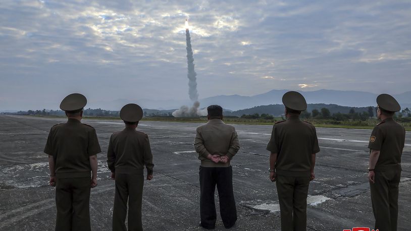 In this photo provided by the North Korean government, North Korean leader Kim Jong Un, center, oversees a launch of, what it says, the country’s newly built Hwasongpho-11-Da-4.5 ballistic missile at an undisclosed place in North Korea Wednesday, Sept. 18, 2024. Independent journalists were not given access to cover the event depicted in this image distributed by the North Korean government. The content of this image is as provided and cannot be independently verified. Korean language watermark on image as provided by source reads: "KCNA" which is the abbreviation for Korean Central News Agency. (Korean Central News Agency/Korea News Service via AP)