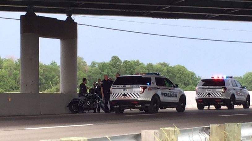 FILE PHOTO: Motorcyclists talk to police on south Interstate 75 at the County Road 25A overpass in Miami County after a hit-and-run crash involving a car that struck members of a group of motorcyclists riding together May 30, 2015. (Drew Simon/Staff)