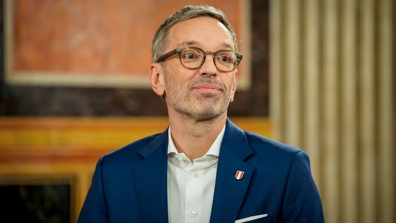 Herbert Kickl, leader of the Freedom Party of Austria smiles at the national broadcaster studio, set up in the parliament building, in Vienna, Austria, Sunday, Sept. 29, 2024, after polls closed in the country's national election. (AP Photo/Andreea Alexandru)