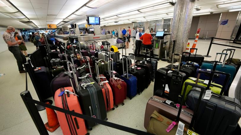 Thousands of Delta passengers were stranded at airports across the U.S., in some cases for several days, after the CrowdStrike IT outage shut down the airline’s scheduling systems. But the delays were just part of the nightmare for many travelers, who then had to wait longer to be reunited with their luggage. Baggage stacks up from delayed travelers in the baggage claim area in Denver International Airport Wednesday, June 16, 2021, in Denver.  (AP Photo/David Zalubowski)